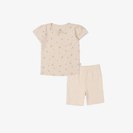 Beige baby pajamas with green star print