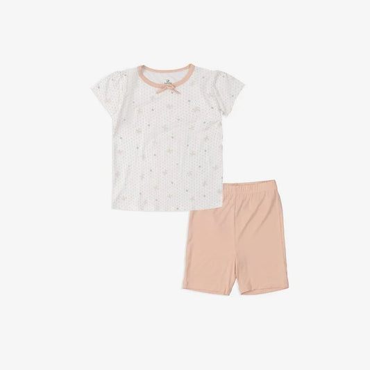 White baby pajamas with pink trim and star print